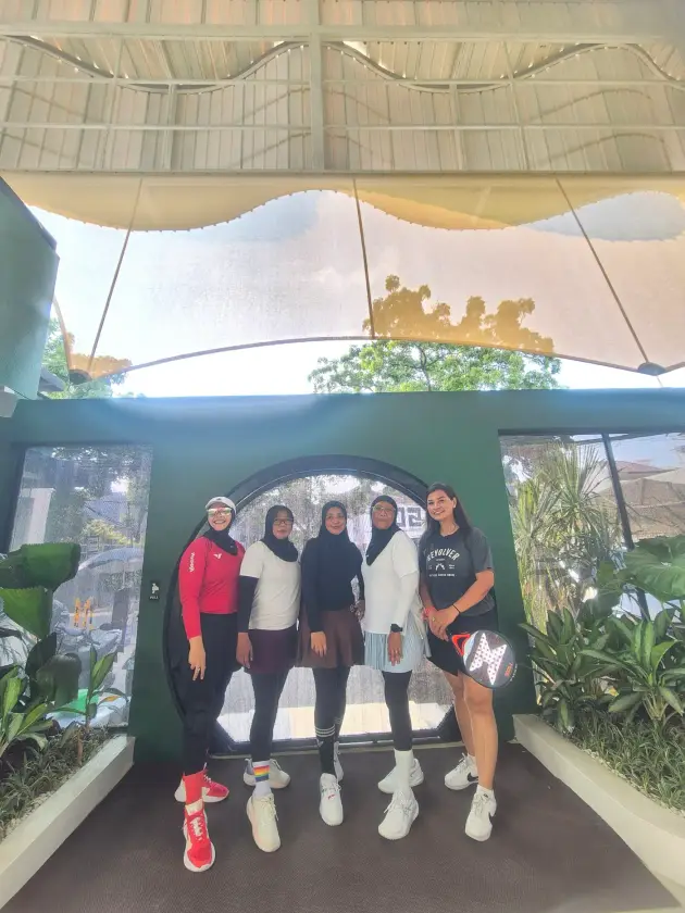 Group of players in front of the round doorway